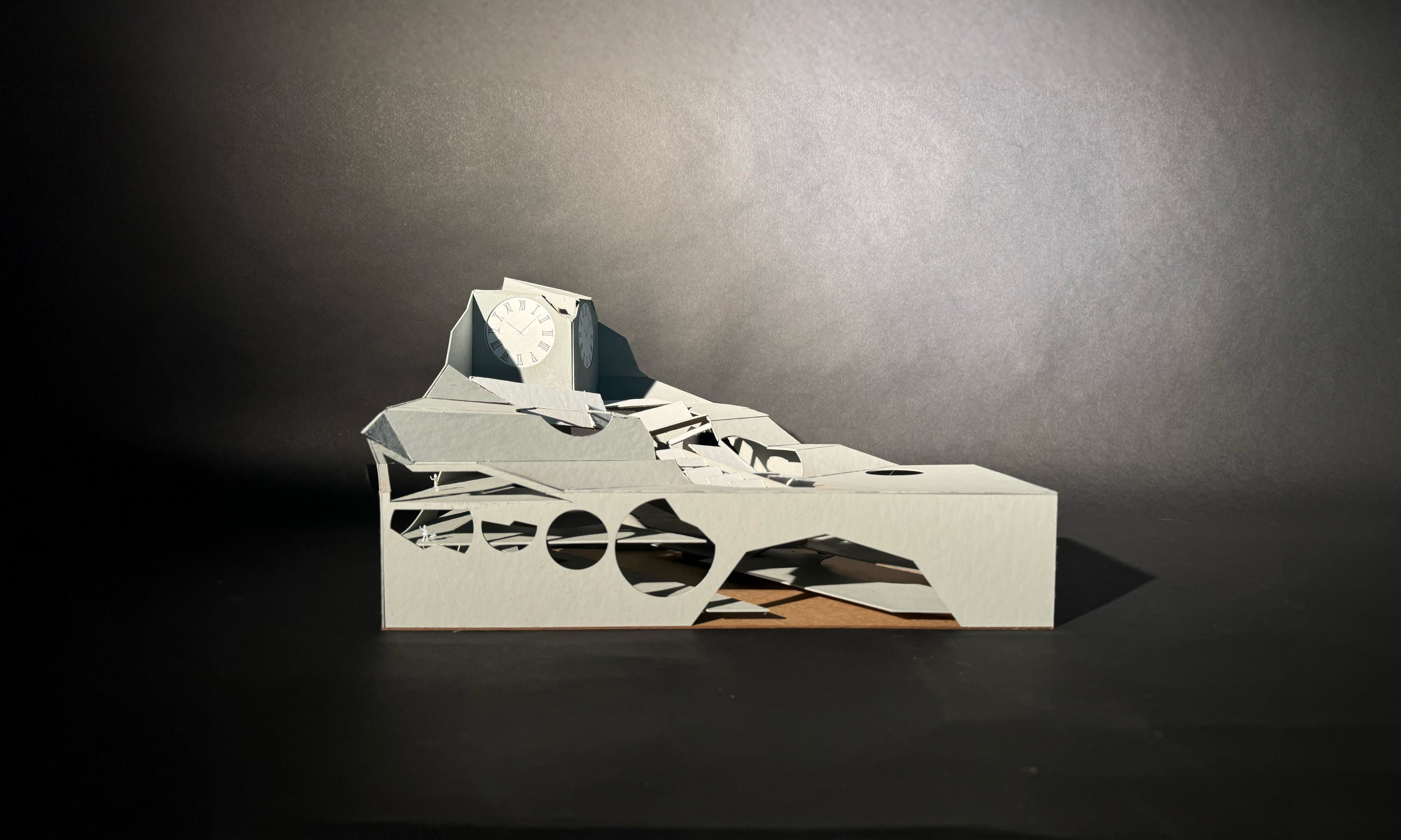 Side view of the white Circular Momentum model: angular folded planes, a row of circular openings and a clock face.